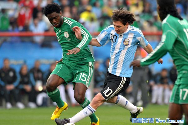 Lionel Messi of Argentina (C) fights for the ball with Lukman Haruna during their group B first round match at the 2010 FIFA World Cup at Ellis Park stadium in Johannesburg, South Africa, on June 12, 2010. (Xinhua/Xu Suhui)
