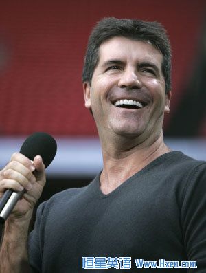 British music mogul Simon Cowell smiles during the Concert for Diana at Wembley Stadium in London July 1, 2007.