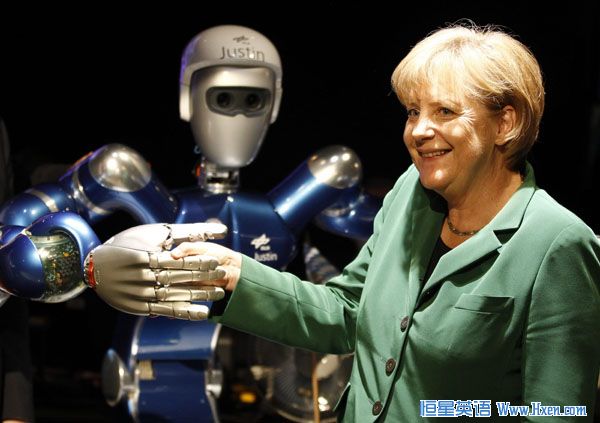 German Chancellor Angela Merkel poses for the media with a robot called 'Justin' at the ILA International Air Show in Schoenefeld south of Berlin, June 8, 2010.(Xinhua/Reuters Photo) German Chancellor Angela Merkel poses for the media with a robot called 'Justin' at the ILA International Air Show in Schoenefeld south of Berlin, June 8, 2010.(Xinhua/Reuters Photo)