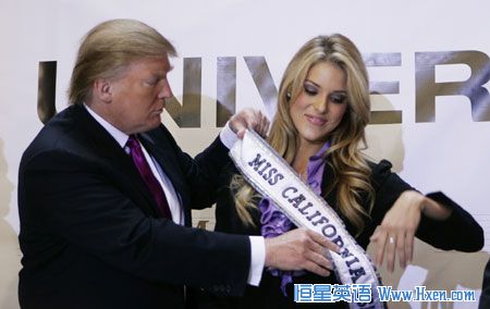 Donald Trump, the owner of the Miss Universe Organization, gives Miss California USA, Carrie Prejean, her sash during a news conference announcing that Prejean would retain her title in New York in this May 12, 2009 file photo. Pageant officials fired Prejean June 10, 2009, citing 