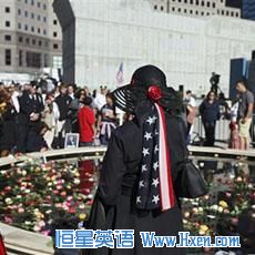 Mourners gather at a reflecting pool where the twin towers once stood during a memorial service commemorating the ninth anniversary of the Sept. 11 terrorist attacks on the World Trade Center in New York, 11 Sep 2010