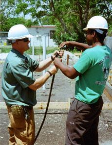 Student Daniel Norzea (right) and instructor Tim Sachse work together at the construction site.