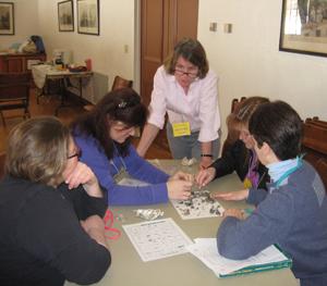 Lisa Purcell training parent volunteers to teach an elementary school workshop on owls.     
