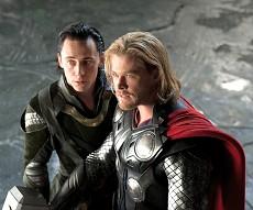 Left to right: Loki (Tom Hiddleston) and Thor (Chris Hemsworth) in THOR, from Paramount Pictures and Marvel Entertainment.