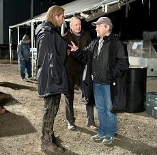 Left to right: Chris Hemsworth (as Thor), Stellan Skarsg&aring;rd (as Selvig), and director Kenneth Branagh discuss a scene on the set of THOR, from Paramount Pictures and Marvel Entertainment.