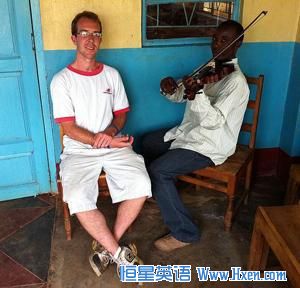 Berklee alumnus Aaron Colverson with a student at Matende High School in Kakamega, Kenya.