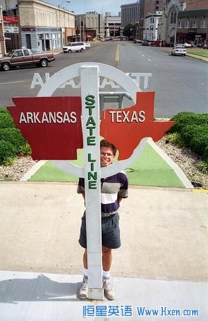 The yellow line separates not only the two sides of State Line Avenue, but also Texas to the left and Arkansas to the right.  