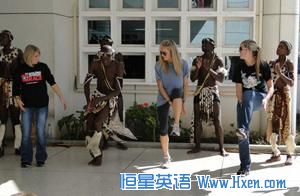 <a href=http://www.hxen.com target=_blank class=infotextkey>study</a> abroad students (from left) Gina Nuccio, Hillary Kinsey and Alyssa Crosby dance with Zulu musicians and performers wearing traditional tribal clothing.