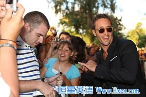 Star Alex O'Loughlin (right) celebrates the second season premiere of 