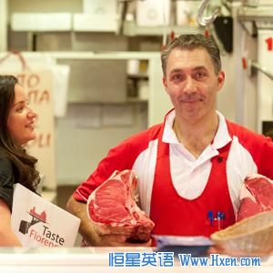 Third-generation Florentine butcher Luca Menoni, with Antoinette Mazzaglia, explains to tourists how he selects the meats for which the city is famous.  