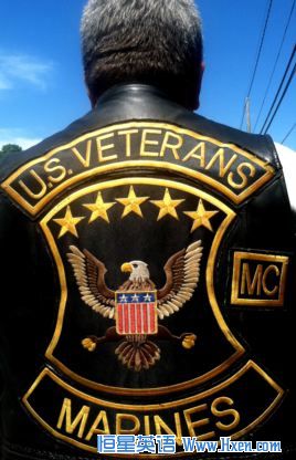 Marine Corps Brian Prochaska of the US Veterans Motorcycles Club displays the patches of his club